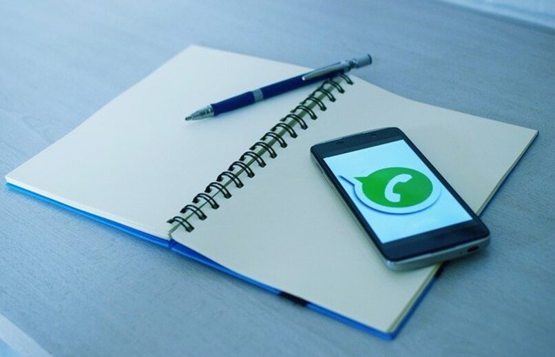 mobile on notebook running whatsapp