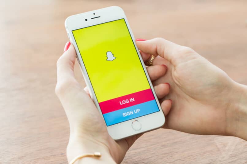 phone with snapchat logo