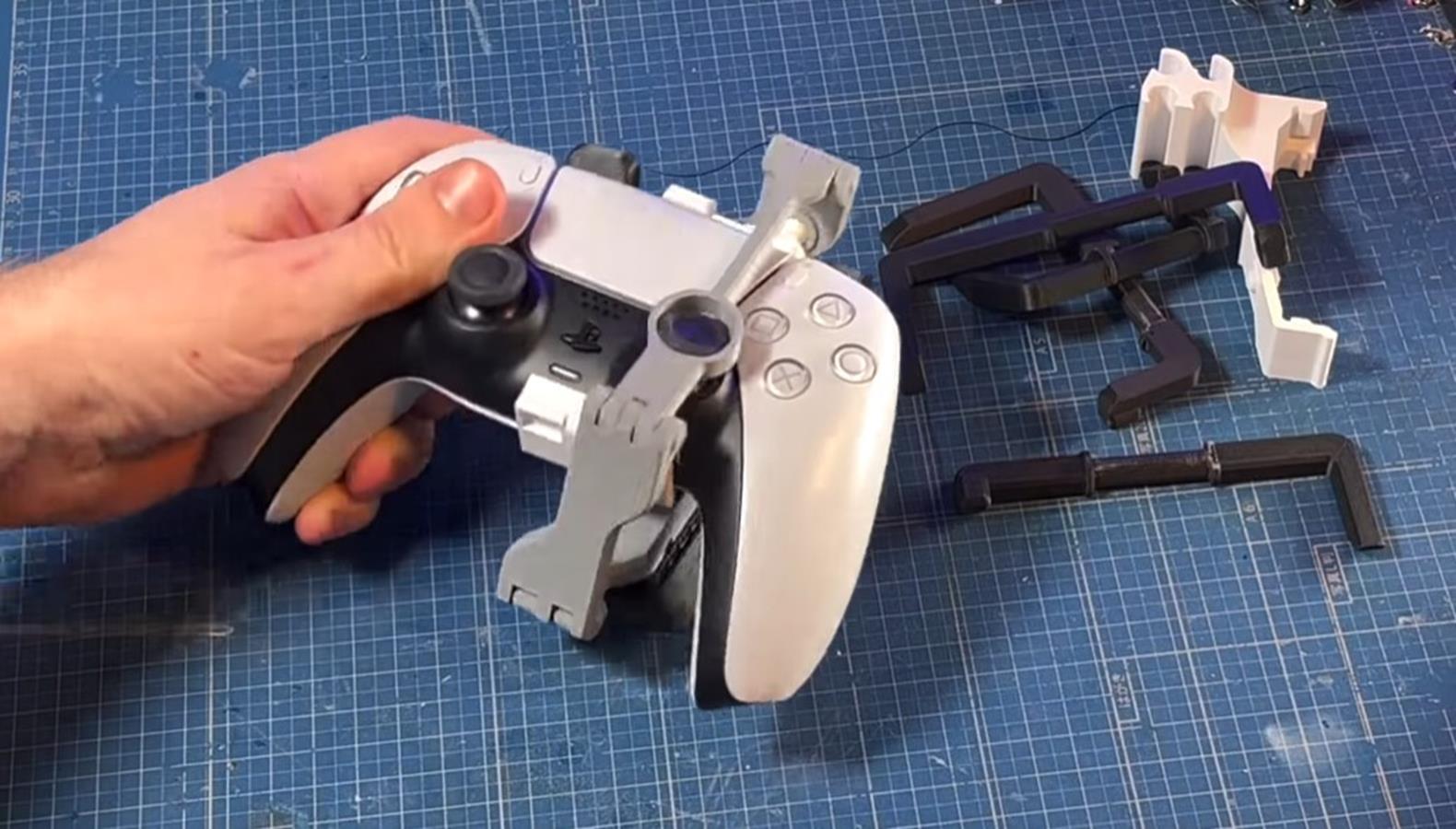 One-handed DualSense operation.  A unique gadget for the PlayStation 5 controller has been created