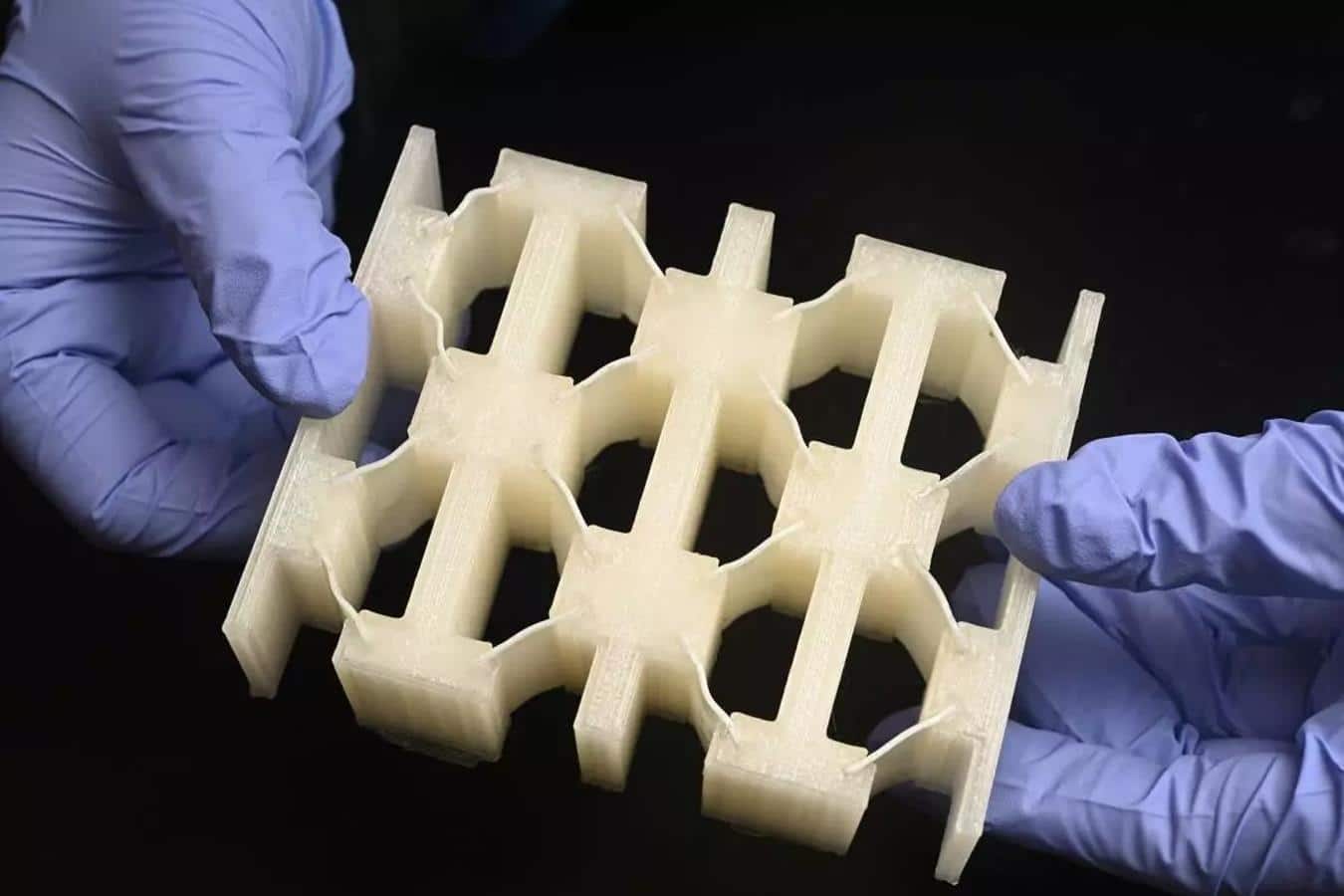 Durable as metal and light as foam.  This new material absorbs energy surprisingly well