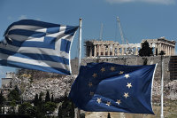 Flags of Greece and the EU against the backdrop of the Parthenon in Athens