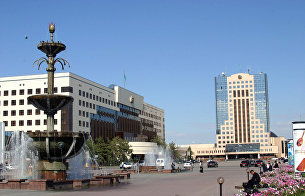 On the central square of Astana - the building of the Presidential Palace (left) and the building of the Parliament of the Republic of Kazakhstan