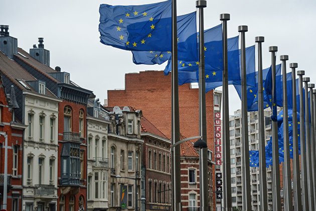 Flags with the symbols of the European Union near the building of the European Commission