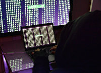 Lines with numbers on computer and laptop screens.  Hacker