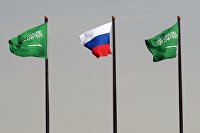 State flags of the Russian Federation and Saudi Arabia at the airport named after King Khaled in Riyadh